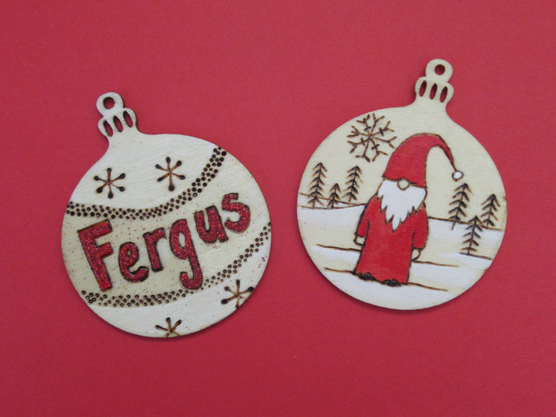 Set of two Christmas decorations, hand decorated using pyrography