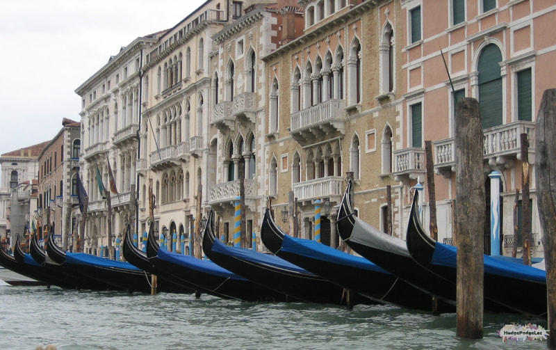 Gondoliers waiting on the canal in Venice, Italy. 