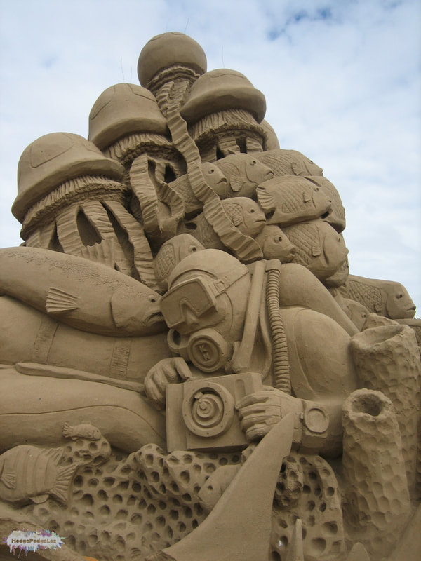 A photograph of a sand sculpture showing an underwater diver. Weston Super Mare, Somerset
