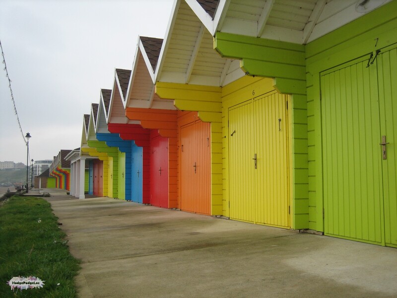 A photograph of brightly coloured beach huts in Scarborough, Yorkshire, England

