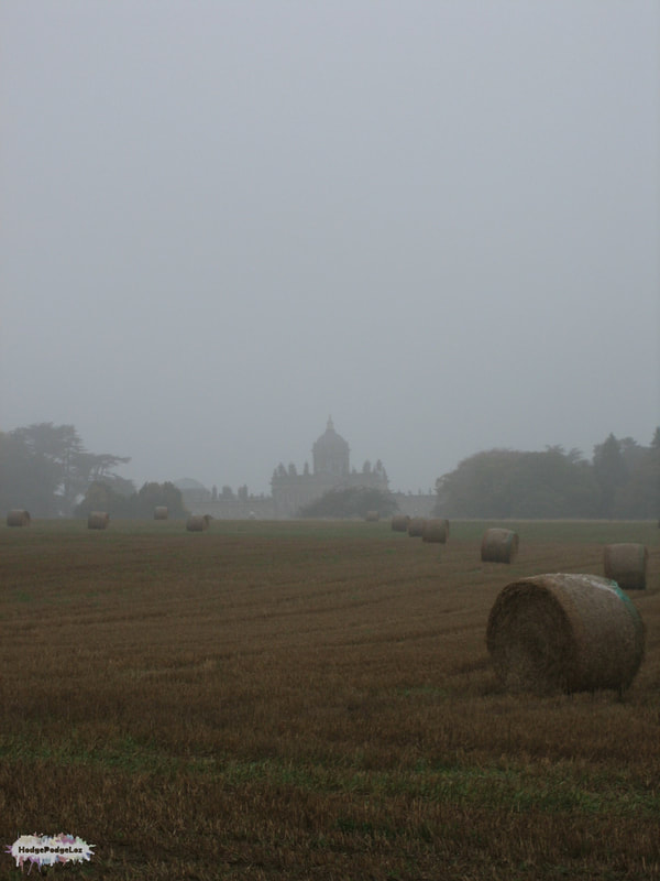 A photograph of Castle Howard in the mist in Yorkshire, England