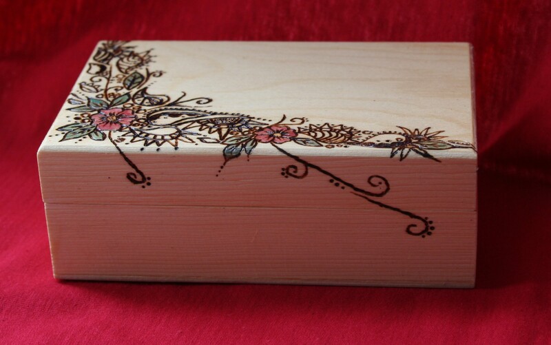 Photograph of wooden box hand decorated using pyrography