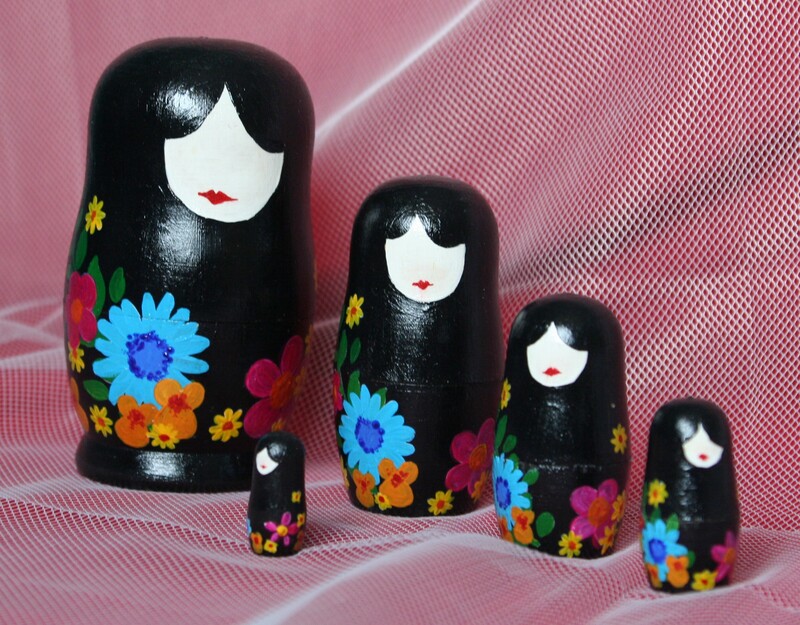 Photograph of set of 5 Russian dolls decorated in a modern style