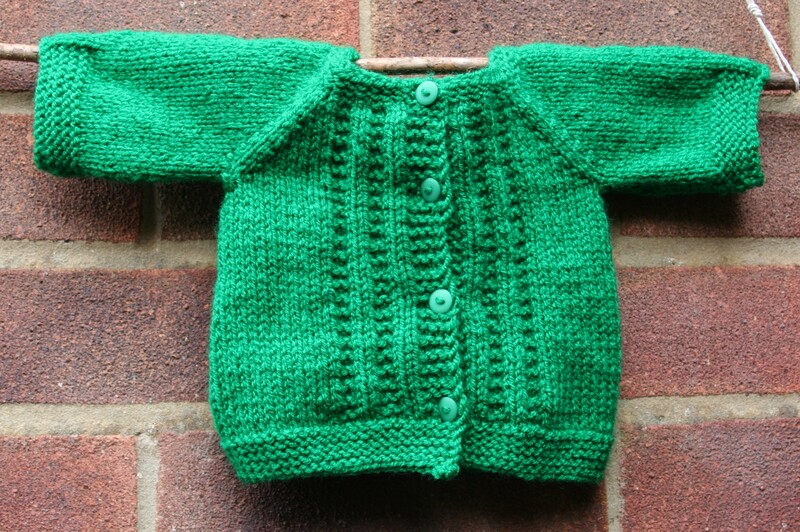 Newborn hand knitted cardigan in Green