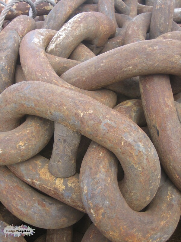 Photograph of large iron chains with rust on
