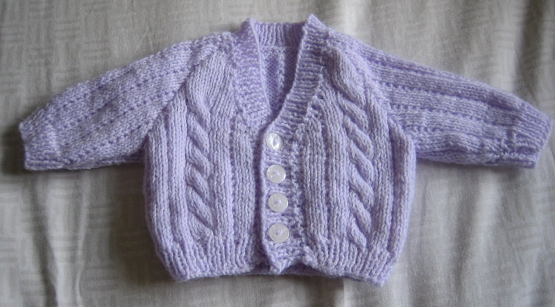 Purple cardigan for premature baby. Hand knitted